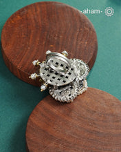 Noori two tone adjustable ring handcrafted in 92.5 sterling silver with hints of gold polish, pearls and kundan work.  Perfect to match your Indian or fusion outfit. 