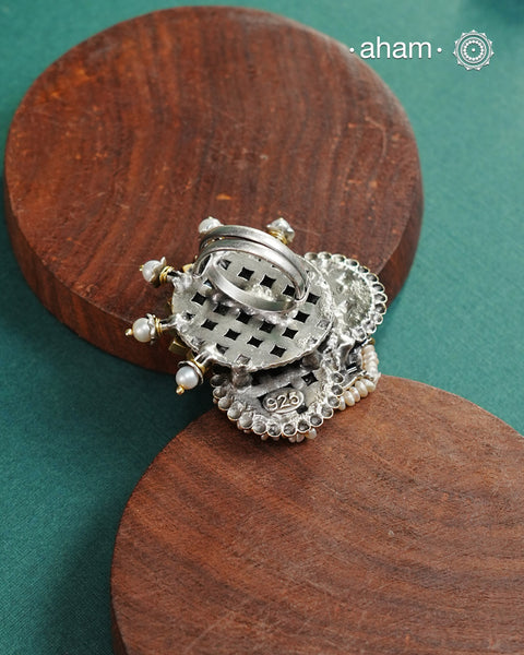 Noori two tone adjustable ring handcrafted in 92.5 sterling silver with hints of gold polish, pearls and kundan work.  Perfect to match your Indian or fusion outfit. 