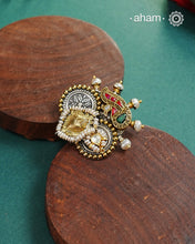 Noori two tone adjustable ring handcrafted in 92.5 sterling silver with hints of gold polish, pearls and kundan work.Perfect to match your Indian or fusion outfit.