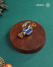 Noori two tone adjustable ring handcrafted in 92.5 sterling silver with carved Lapiz in the center andhints of gold polish and kundan work.  Perfect to match your Indian or fusion outfit. 