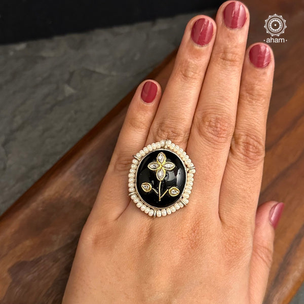 Ira adjustable ring, handcrafted intricately in 92.5 sterling silver with black onyx stone and Kundan inlay work. Perfect for add a bit of glamour to your outfit.