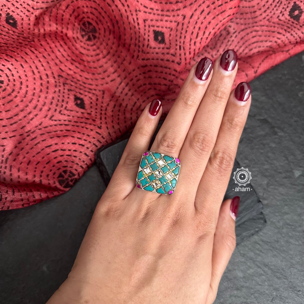 Ira adjustable ring, handcrafted intricately in 92.5 sterling silver with semi precious stone and Kundan work. Perfect to add colour and glamour to your look. 