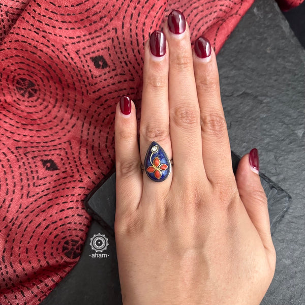 Lapiz stone set in 92.5 silver with coral and kundan inlay work highlights, Beautiful adjustable ring perfect for special occasions and festivities.   
