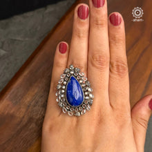 Ira stone set in 92.5 silver with Blue Stone. Beautiful adjustable ring perfect for special occasions and festivities.     