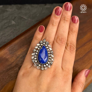 Ira stone set in 92.5 silver with Blue Stone. Beautiful adjustable ring perfect for special occasions and festivities.     