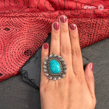 Ira adjustable ring, handcrafted& intricately in 92.5 sterling silver with turquoise stone center. Perfect to make a statement.