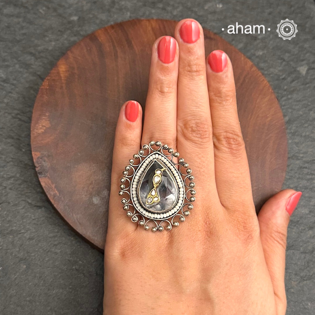 Ira adjustable ring, handcrafted intricately in 92.5 sterling silver with semi precious stone and Kundan work. Perfect for special occasions and festivities.
