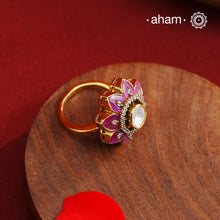 This exquisite ring features a dazzling moissanite center set within an elegant flower design, accented by vibrant fuchsia pink stones. Crafted from 92.5% sterling silver and enhanced with a refined gold polish, for a luxurious finish. Perfect for those seeking a sophisticated blend of classic craftsmanship and contemporary style.