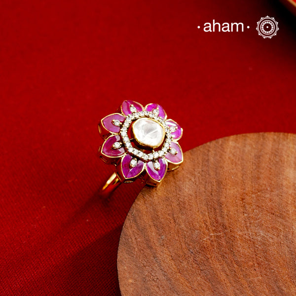 This exquisite ring features a dazzling moissanite center set within an elegant flower design, accented by vibrant fuchsia pink stones. Crafted from 92.5% sterling silver and enhanced with a refined gold polish, for a luxurious finish. Perfect for those seeking a sophisticated blend of classic craftsmanship and contemporary style.