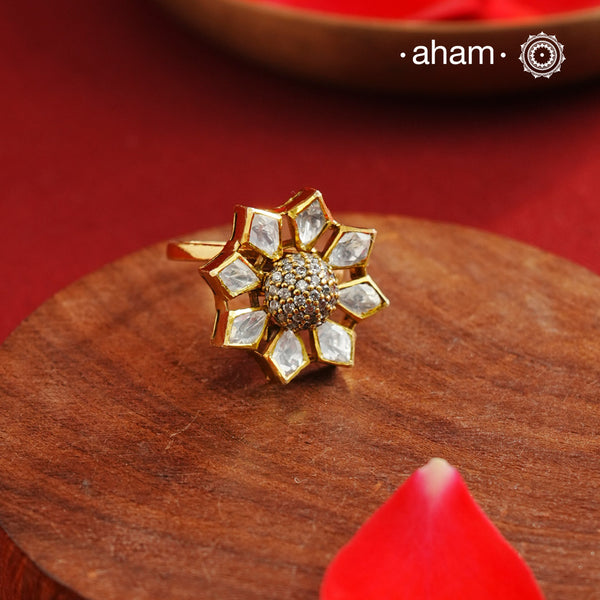 This expertly handcrafted silver ring showcases a brilliant moissanite stone set against a refined gold-polished finish. Its adjustable band offers a personalized fit, making it a sophisticated choice for special occasions and festive events. Combining artisanal craftsmanship with timeless elegance, this ring enhances any ensemble with subtle luxury.