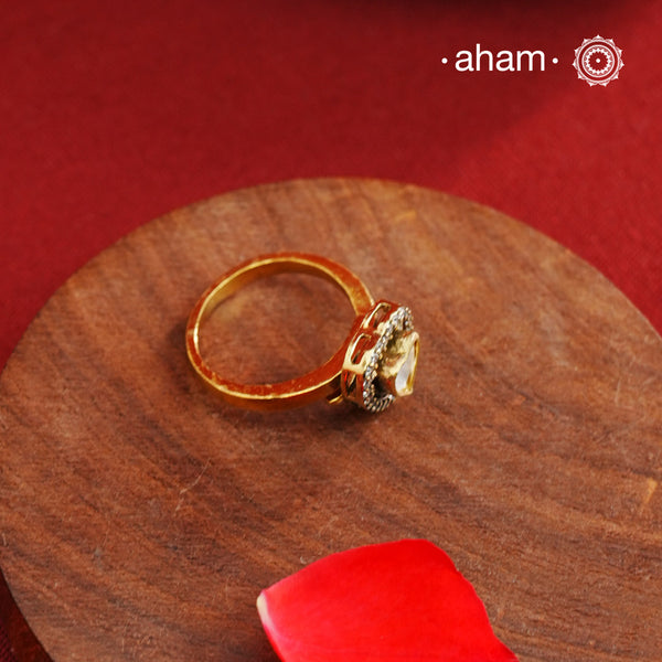 This expertly crafted heart-shaped ring showcases a brilliant moissanite center stone, encircled by finely set American diamonds. Made from high-quality 925 sterling silver and enhanced with a rich gold polish, the piece offers elegant shine. Ideal for those seeking a sophisticated accessory that combines classic design with exceptional craftsmanship.