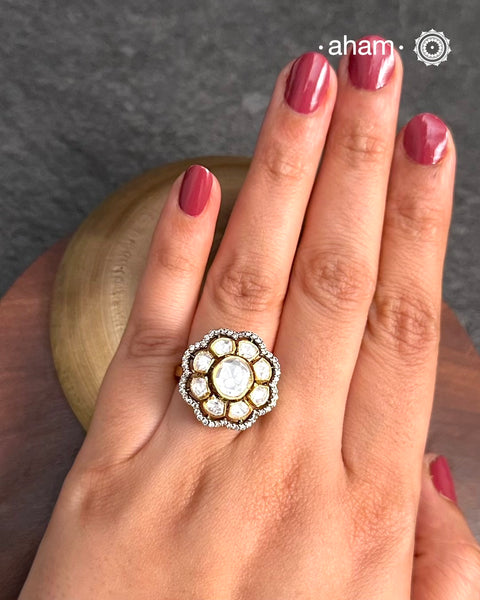 This exquisite ring features dazzling moissanite stones set within an elegant flower design, Crafted from 92.5% sterling silver and enhanced with a refined gold polish, for a luxurious finish. Perfect for those seeking a sophisticated blend of classic craftsmanship and contemporary style.