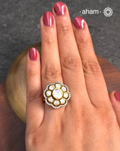 This exquisite ring features dazzling moissanite stones set within an elegant flower design, Crafted from 92.5% sterling silver and enhanced with a refined gold polish, for a luxurious finish. Perfect for those seeking a sophisticated blend of classic craftsmanship and contemporary style.