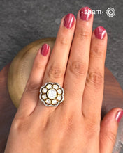 This exquisite ring features dazzling moissanite stones set within an elegant flower design, Crafted from 92.5% sterling silver and enhanced with a refined gold polish, for a luxurious finish. Perfect for those seeking a sophisticated blend of classic craftsmanship and contemporary style.