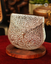 Handcrafted 92.5 sterling silver clutch with intricate floral carvings. Statement bags perfect for festive occasions, carry your accessories in style.