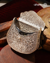 Handcrafted 92.5 sterling silver clutch with intricate floral carvings. Statement bags perfect for festive occasions, carry your accessories in style.