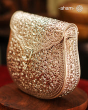 Handcrafted 92.5 sterling silver clutch with intricate floral carvings. Statement bags perfect for festive occasions, carry your accessories in style.