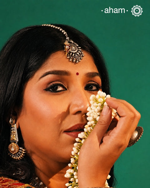 Beautiful Maang Tikka crafted in silver with a gold toned kundan parrot highlight.