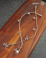 Dress your feet with these delicate and beautiful anklets with ghungroos. Crafted in silver with traditional artistry. Pair it with your anarkali, rajasthani jootis, and a potli bag to complete your look.