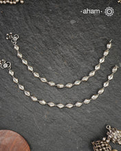 Dress your feet with these delicate and beautiful classic anklets. Crafted in silver with traditional artistry. Pair it with your anarkali, rajasthani jootis, and a potli bag to complete your look.