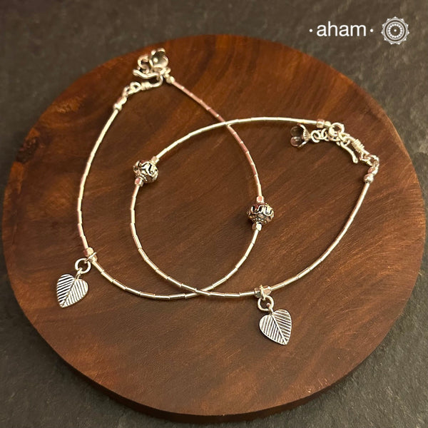 Versatile, fun, unmistakably you! Stunning silver anklet with little charms crafted in fine 92.5 silver. Dress your feet with these delicate and beautiful statement anklets.
The price is for a pair