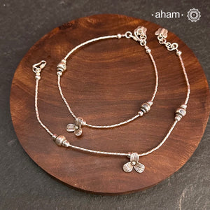 Versatile, fun, unmistakably you! Stunning silver anklet with little charms crafted in fine 92.5 silver. Dress your feet with these delicate and beautiful statement anklets.
The price is for a pair