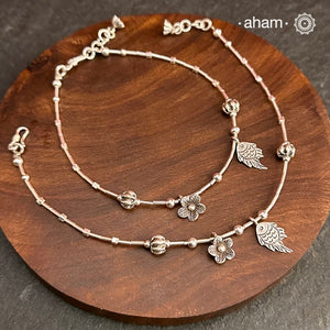 Versatile, fun, unmistakably you! Stunning silver anklet with little charms crafted in fine 92.5 silver. Dress your feet with these delicate and beautiful statement anklets.
The price is for a pair