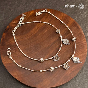 Versatile, fun, unmistakably you! Stunning silver anklet with little charms crafted in fine 92.5 silver. Dress your feet with these delicate and beautiful statement anklets.
The price is for a pair