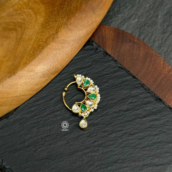 Beautiful clip on nath with fine kundan work, Crafted in silver with gold polish.
Sits on the left side of the nostril.