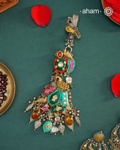 Challa/Juda/Chatka/ Guchha or waist key chains hold a special place in a woman’s trousseau, symbolizing tradition and elegance. The Noori Two Tone Silver Waist Key Ring features exquisite kundan work and carefully selected fine stones, all crafted in high-quality silver. This unique piece blends timeless craftsmanship with distinctive design, making it a meaningful accessory that complements your individuality.