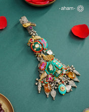 Challa/Juda/Chatka/ Guchha or waist key chains hold a special place in a woman’s trousseau, symbolizing tradition and elegance. The Noori Two Tone Silver Waist Key Ring features exquisite kundan work and carefully selected fine stones, all crafted in high-quality silver. This unique piece blends timeless craftsmanship with distinctive design, making it a meaningful accessory that complements your individuality.