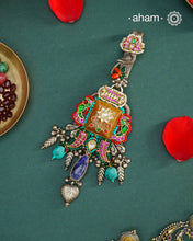 Challa/Juda/Chatka/ Guchha or waist key chains hold a special place in a woman’s trousseau, symbolizing tradition and elegance. The Noori Two Tone Silver Waist Key Ring features exquisite kundan work and carefully selected fine stones, all crafted in high-quality silver. This unique piece blends timeless craftsmanship with distinctive design, making it a meaningful accessory that complements your individuality.