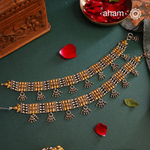 Enhance your style with the timeless elegance of the Dual Tone Silver anklets. Handcrafted by skilled karigars in Barmer, Rajasthan, this neckpiece features traditional Bandhel work, where a thin sheet of hand beaten&nbsp;22 carat gold is set on 92.5 silver using a unique wax setting technique. A classic representation of fine Indian traditional craftsmanship.