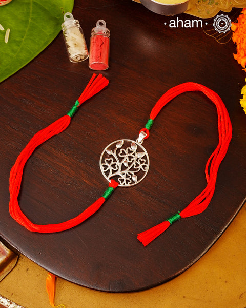 Beautiful Silver Rakhi 
Make this Rakshabandhan Memorable with this handcrafted 92.5 Silver Rakhi

Silver dial weaved with cotton thread for an ever-lasting Knot.