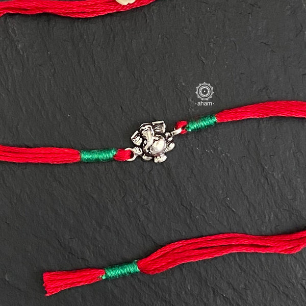 Beautiful Handcrafted Silver Rakhi for little kids.  Make this Rakshabandhan Memorable with this handcrafted Rakhi for an ever-lasting Knot.  Super cute Rakhi in 925 Silver dial weaved with cotton thread.  Tip: you can later convert this into a key chain charm or a pendant as well  Price is for one piece rakhi Only   Roli (kumkum), Akshat (Chawal) and  Mishri shipped along with India orders only  Please note, Rakhi Orders will be packed and shipped in a single box only and not multiple boxes.