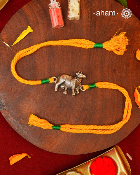 Celebrate Raksha Bandhan with the blessings of Kamdhenu, the sacred divine cow revered as the symbol of abundance, prosperity, and nurturing love. Handcrafted in silver, this rakhi brings together timeless craftsmanship and meaningful symbolism, making it more than just a festive thread—it becomes a cherished keepsake.