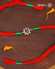 Beautiful Silver Rakhi. Make this Rakshabandhan Memorable with this handcrafted Rakhi for an ever-lasting Knot.

Invoke the blessings of the universe with this elegant Om Symbol Rakhi crafted in silver with cotton threads.