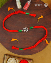 Beautiful Silver Rakhi. Make this Rakshabandhan Memorable with this handcrafted Rakhi for an ever-lasting Knot.

Invoke the blessings of the universe with this elegant Om Symbol Rakhi crafted in silver with cotton threads.