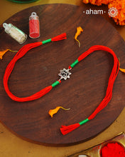 Beautiful Silver Rakhi. Make this Rakshabandhan Memorable with this handcrafted Rakhi for an ever-lasting Knot.

Invoke the blessings of the universe with this elegant Om Symbol Rakhi crafted in silver with cotton threads.