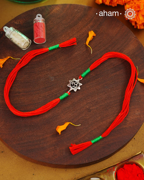 Beautiful Silver Rakhi. Make this Rakshabandhan Memorable with this handcrafted Rakhi for an ever-lasting Knot.

Invoke the blessings of the universe with this elegant Om Symbol Rakhi crafted in silver with cotton threads.