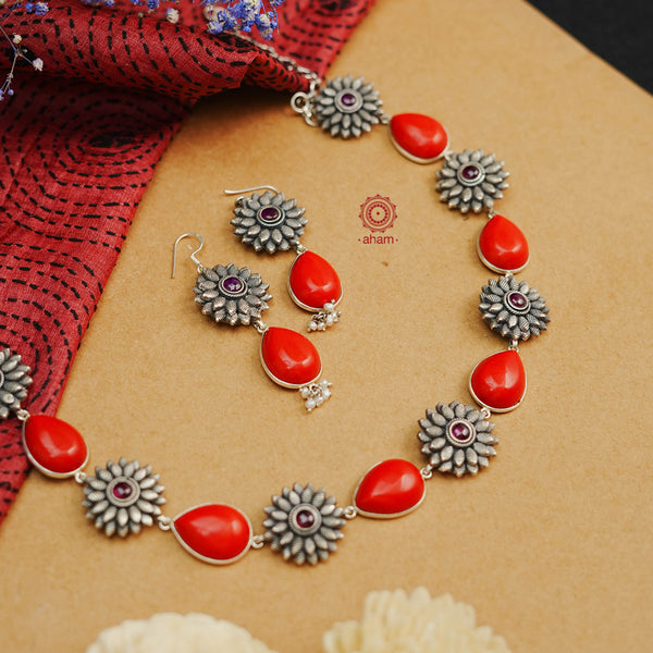 Handcrafted 92.5 sterling silver neckpiece and earrings set. Pendant with intricate amulet, floral coral stone setting, double peacock motif and cultured pearls.