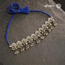 This Mewad Flower Silver Choker and Earring Set showcases expert craftsmanship in sterling silver, featuring intricate floral motifs inspired by traditional Mewad designs. The set is enhanced with delicate ghungroos that add subtle movement and a melodic charm. Perfect for elevating both ethnic and contemporary outfits, this classic combination offers timeless elegance and artisanal detail.