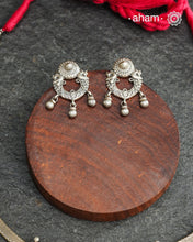 The Mewad Silver Neckpiece &amp; Earrings Set showcases expertly crafted silver paired with delicate ghungroos, designed to complement professional attire effortlessly. This lightweight and elegant set brings a refined cultural touch to your workwear, ensuring comfort and sophisticated style throughout your busy day.