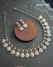 Elevate your collection with this exquisite Mewad Silver Neckpiece &amp; Earrings Set, meticulously crafted from premium 92.5 sterling silver. Each piece showcases intricate detailing while remaining remarkably lightweight. The coordinated set offers versatile styling options, seamlessly transitioning from everyday elegance to special occasions. Whether you're curating your personal wardrobe or seeking a thoughtful gift for someone discerning, this handcrafted ensemble delivers timeless sophistication and r