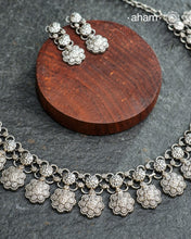 Elevate your collection with this exquisite Mewad Silver Neckpiece & Earrings Set, meticulously crafted from premium 92.5 sterling silver. Each piece showcases intricate detailing while remaining remarkably lightweight. The coordinated set offers versatile styling options, seamlessly transitioning from everyday elegance to special occasions. Whether you're curating your personal wardrobe or seeking a thoughtful gift for someone discerning, this handcrafted ensemble delivers timeless sophistication and refin