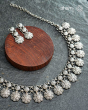 Elevate your collection with this exquisite Mewad Silver Neckpiece & Earrings Set, meticulously crafted from premium 92.5 sterling silver. Each piece showcases intricate detailing while remaining remarkably lightweight. The coordinated set offers versatile styling options, seamlessly transitioning from everyday elegance to special occasions. Whether you're curating your personal wardrobe or seeking a thoughtful gift for someone discerning, this handcrafted ensemble delivers timeless sophistication and refin