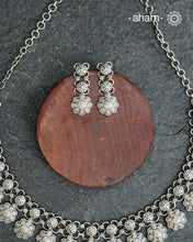 Elevate your collection with this exquisite Mewad Silver Neckpiece & Earrings Set, meticulously crafted from premium 92.5 sterling silver. Each piece showcases intricate detailing while remaining remarkably lightweight. The coordinated set offers versatile styling options, seamlessly transitioning from everyday elegance to special occasions. Whether you're curating your personal wardrobe or seeking a thoughtful gift for someone discerning, this handcrafted ensemble delivers timeless sophistication and refin