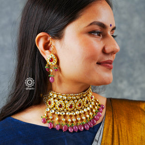 Jewellery is an art and it hold a great amount of cultural significance. This neckpiece earring set is a fine example of a traditional designs that never go out of style. Jadua Kundan set in sterling silver, dipped in gold and with beautiful semi precious stone highlights. Perfect for intimate weddings and upcoming festive celebrations.