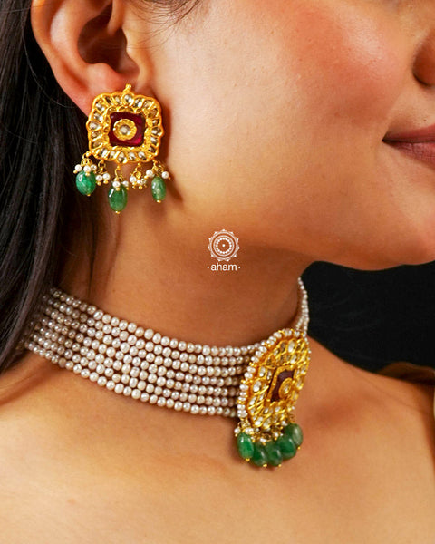 Adorn yourself with this breathtaking Kundan Gold Polish Silver Choker Set. Crafted from 92.5 sterling silver with stunning kundan detailing, the set features cultured pearls for a beautiful, royal feel. Style with any traditional outfit for an elegant look.