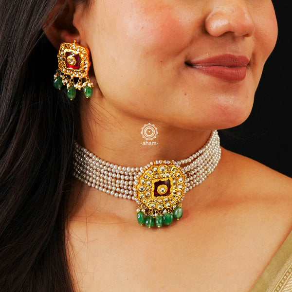 Adorn yourself with this breathtaking Kundan Gold Polish Silver Choker Set. Crafted from 92.5 sterling silver with stunning kundan detailing, the set features cultured pearls for a beautiful, royal feel. Style with any traditional outfit for an elegant look.